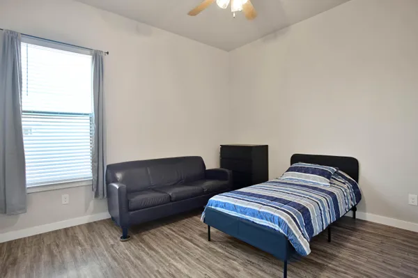 a kitchen with granite countertop cabinets and steel stainless steel appliances