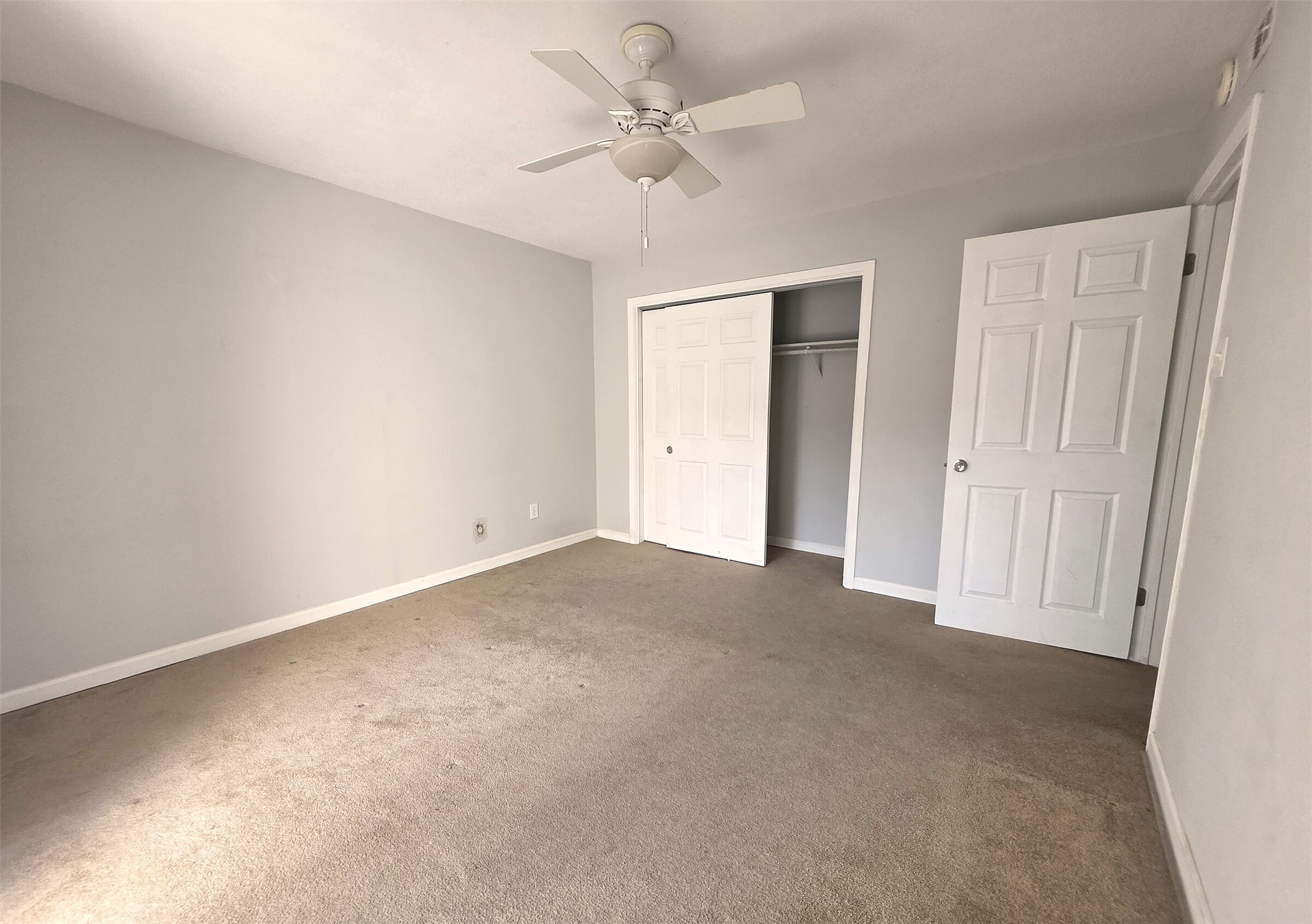 703 Castle Ridge Road, Unit B Austin, TX 78746 - Photo 11 of 18 Plush carpet and a spacious closet define this comfortable secondary bedroom.