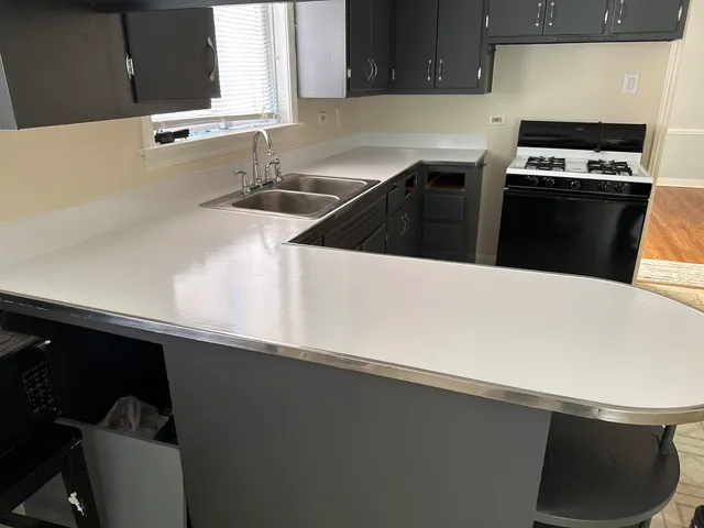 a kitchen with a sink and a stove