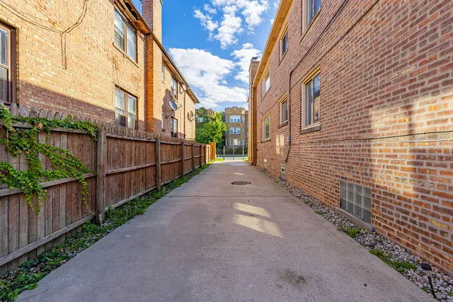 a view of a pathway with a building in the background