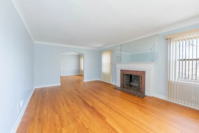 a bedroom with a bed and a fireplace