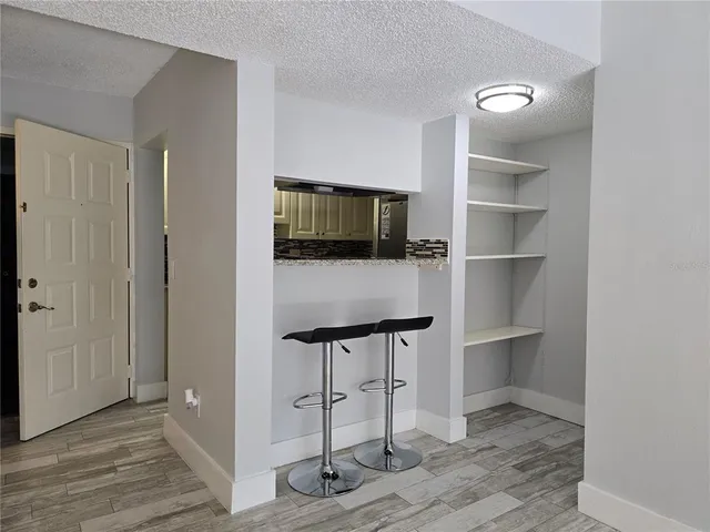 a view of a livingroom with furniture and workspace
