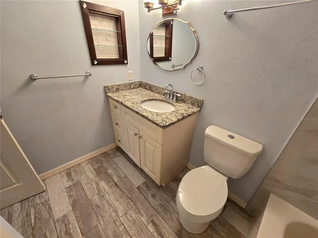 a living room with a bed furniture and a window