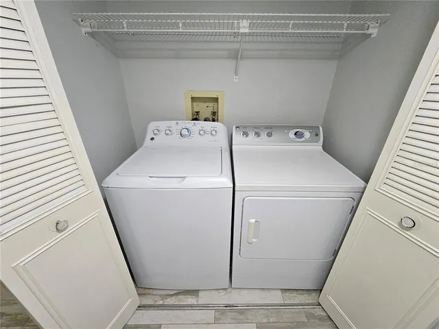 a view of two chairs in a balcony