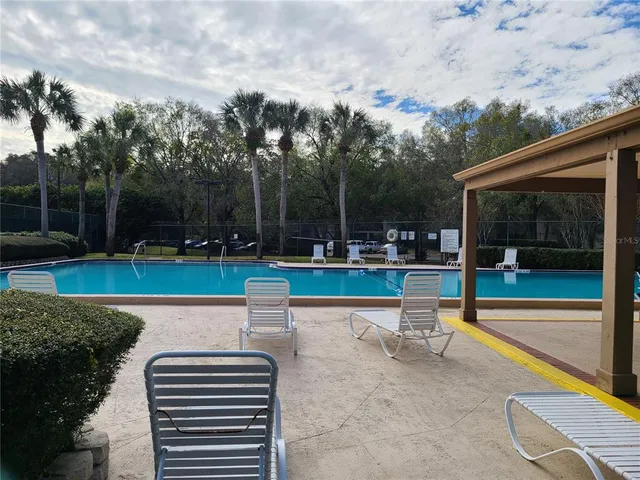 a street sign that is on a wooden wall