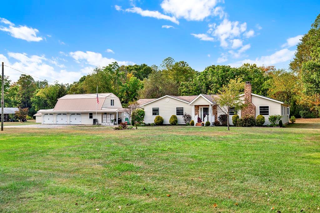 1261 Griffith Road Ligonier, PA 15658 - Photo 2 of 39 a front view of a house with garden and trees