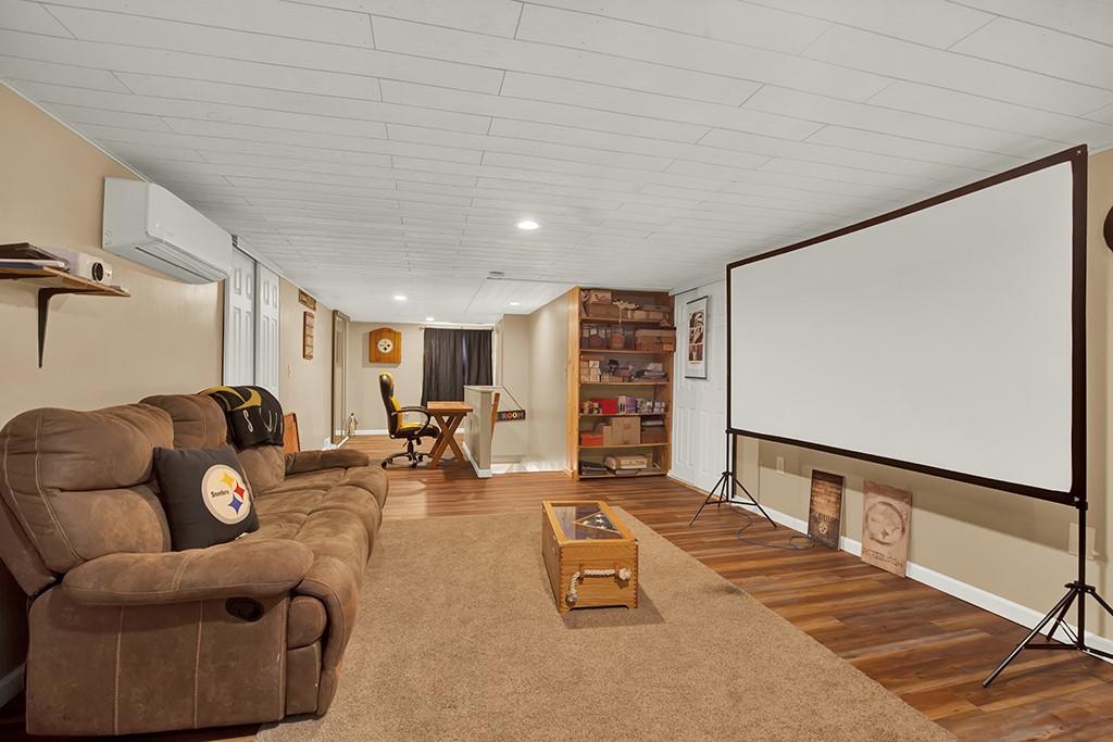 1261 Griffith Road Ligonier, PA 15658 - Photo 26 of 39 a living room with furniture and a flat screen tv