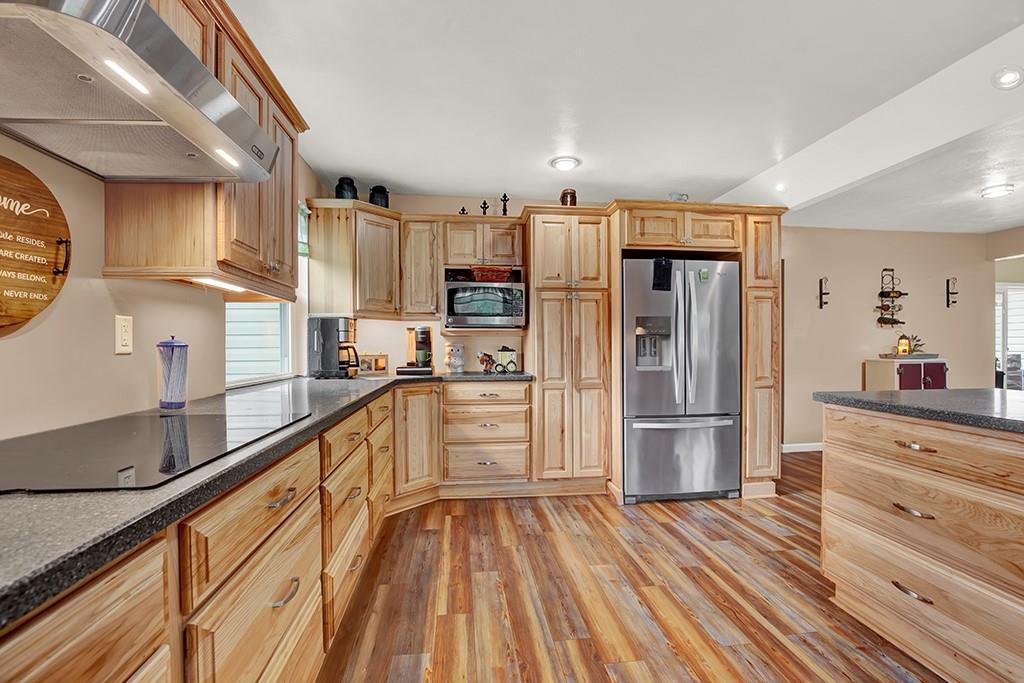 1261 Griffith Road Ligonier, PA 15658 - Photo 7 of 39 a kitchen with stainless steel appliances a refrigerator and a stove top oven