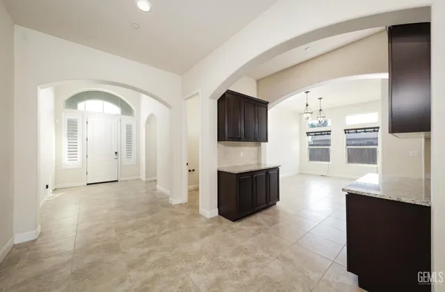 a kitchen with counter top space cabinets and stainless steel appliances