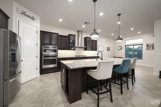 an empty room with windows and fireplace