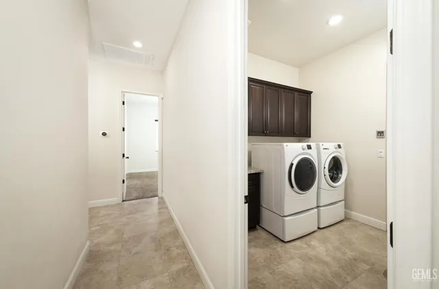a bathroom with a granite countertop sink mirror toilet and bathtub