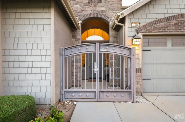 a view of a brick house with plants