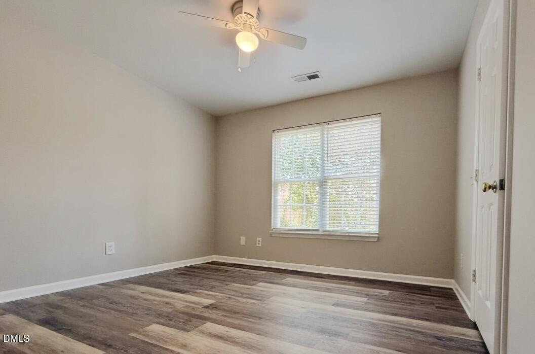 10 Red Lane Raleigh, NC 27606 - Photo 11 of 13 an empty room with wooden floor and windows