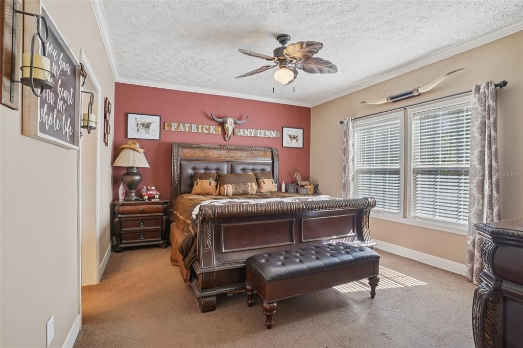 7459 Southwest 5th Avenue Ocala, FL 34476 - Photo 20 of 55 a bedroom with a bed and a chandelier