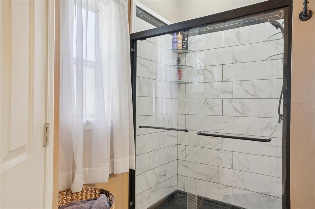 7459 Southwest 5th Avenue Ocala, FL 34476 - Photo 22 of 55 a bathroom with a shower