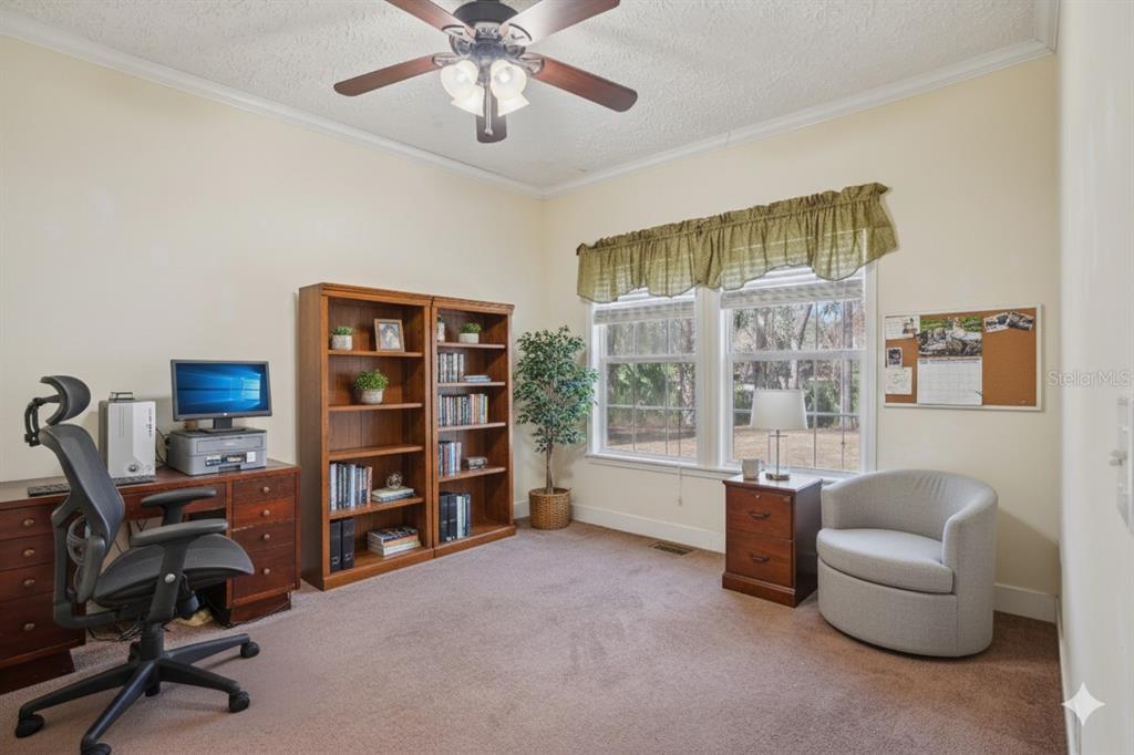 7459 Southwest 5th Avenue Ocala, FL 34476 - Photo 26 of 55 a view of a livingroom with workspace and a window