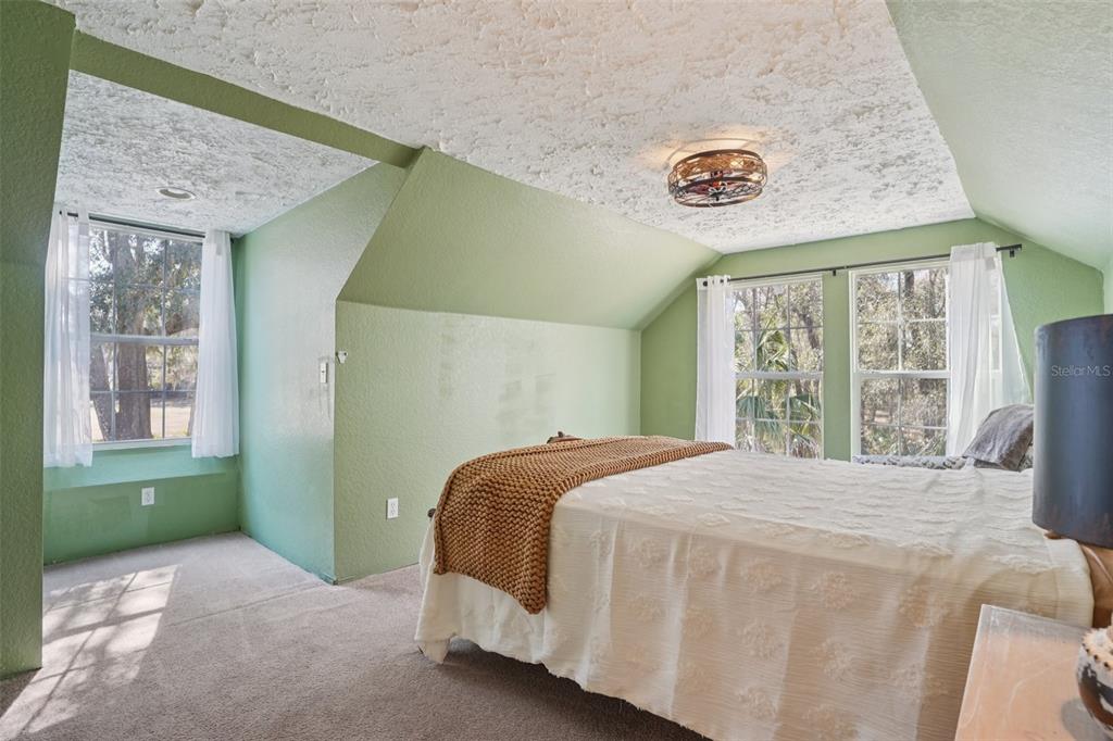 7459 Southwest 5th Avenue Ocala, FL 34476 - Photo 29 of 55 a bedroom with a bed and a window