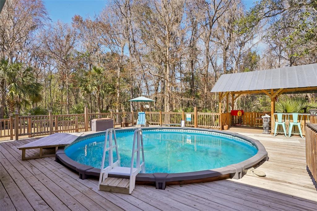 7459 Southwest 5th Avenue Ocala, FL 34476 - Photo 42 of 55 a view of a swimming pool with deck and patio