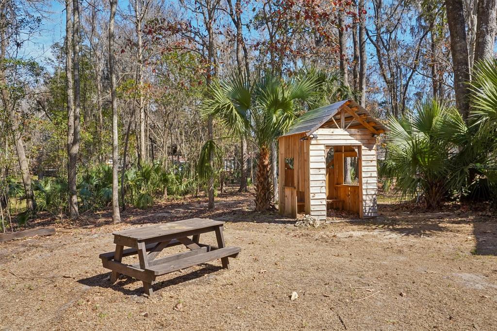 7459 Southwest 5th Avenue Ocala, FL 34476 - Photo 49 of 55 a front view of a house with a yard
