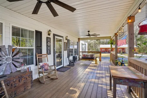 a view of living room filled with furniture and wooden floor
