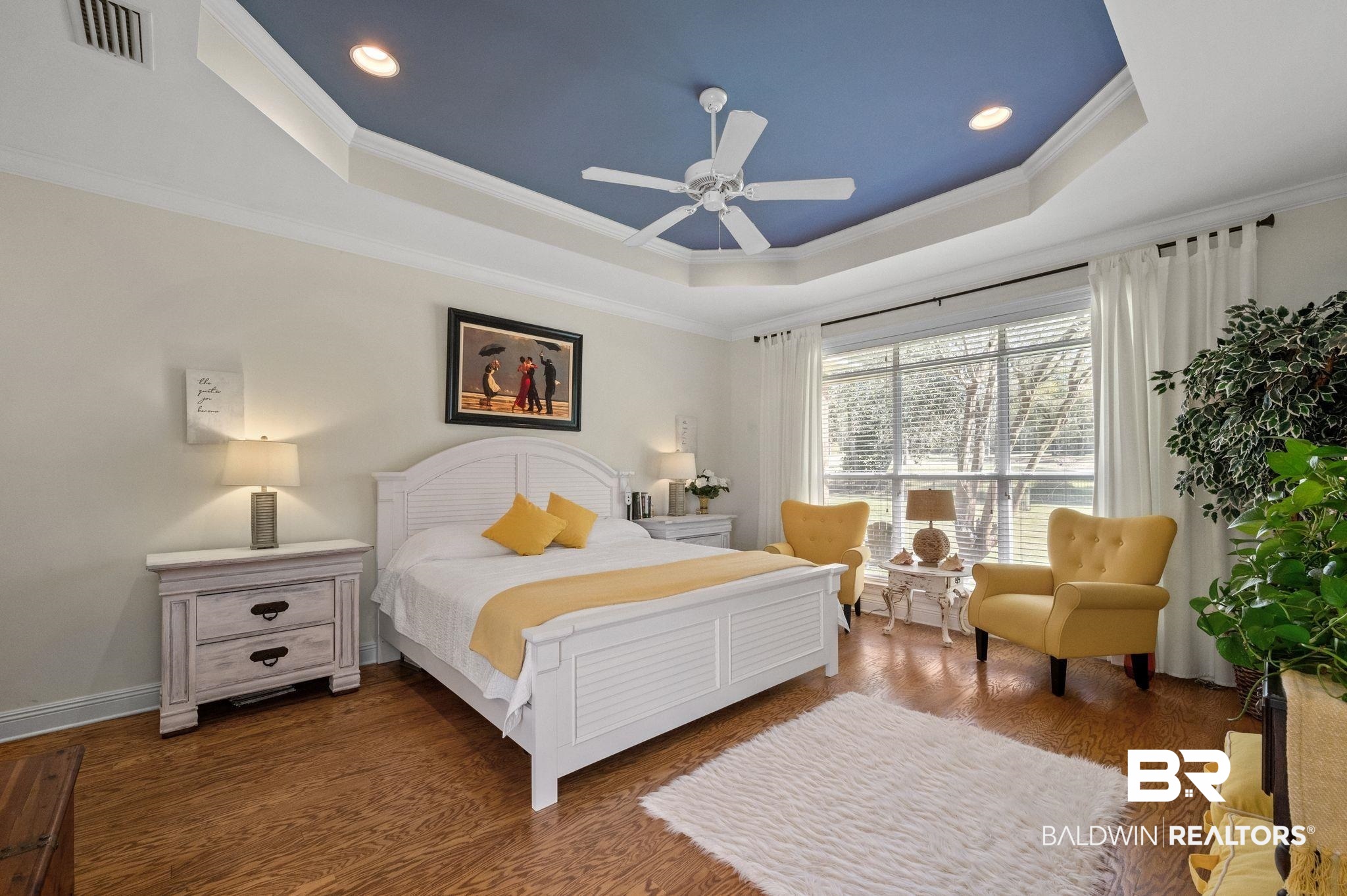 30151 Dolive Ridge Daphne, AL 36527 - Photo 11 of 37 Bedroom with visible vents, dark wood-type flooring, ornamental molding, a tray ceiling, and ceiling fan