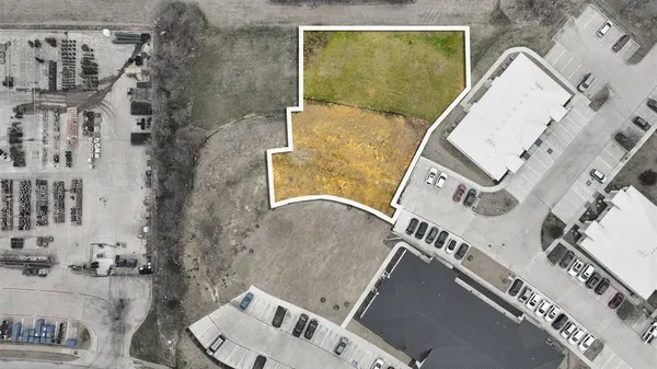 an aerial view of a house with a swimming pool