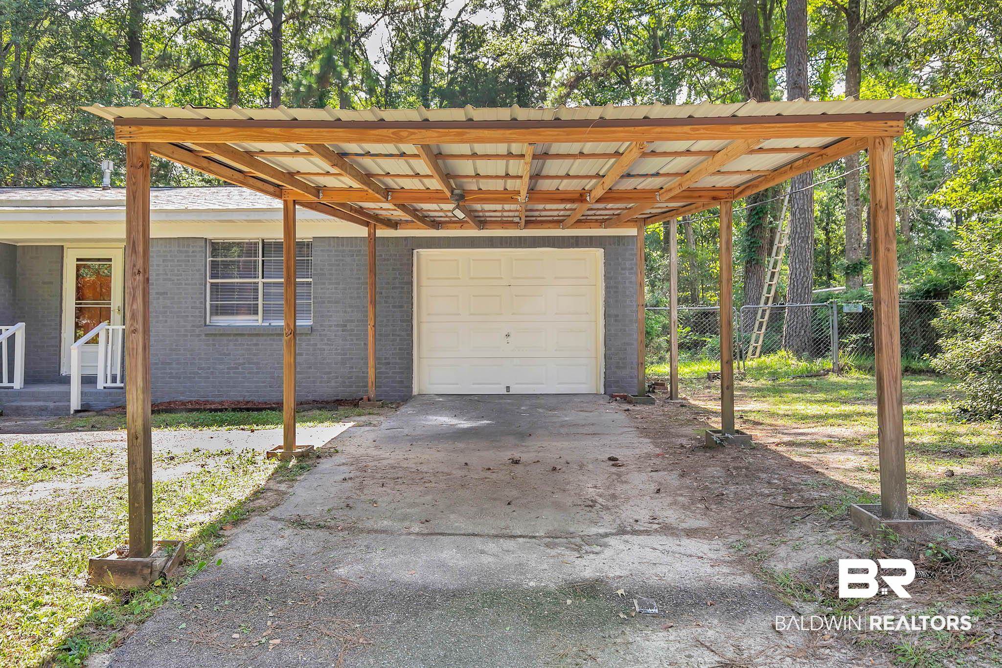 3304 Armond Drive Mobile, AL 36605 - Photo 61 of 62 Garage with a carport and driveway