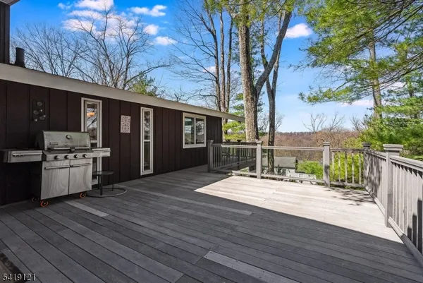 a house with yard outdoor seating and wooden floor