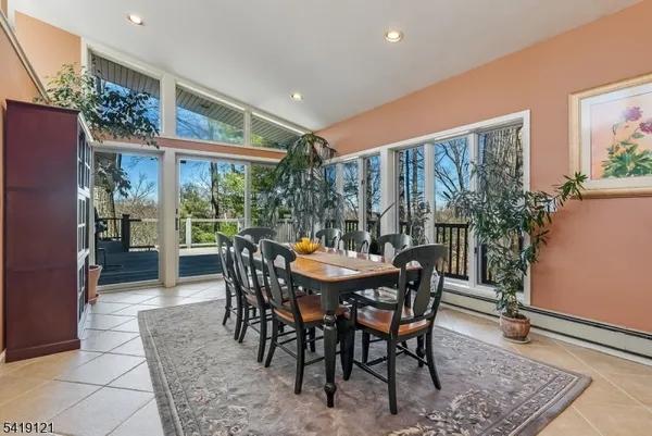 a view of an outside dining space with furniture