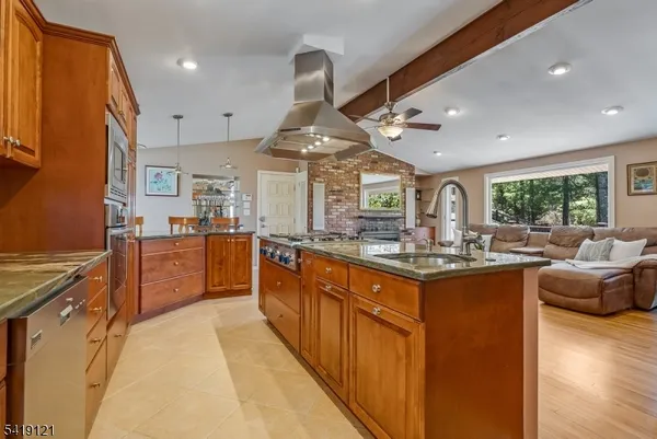 a kitchen with stainless steel appliances granite countertop lots of counter top space