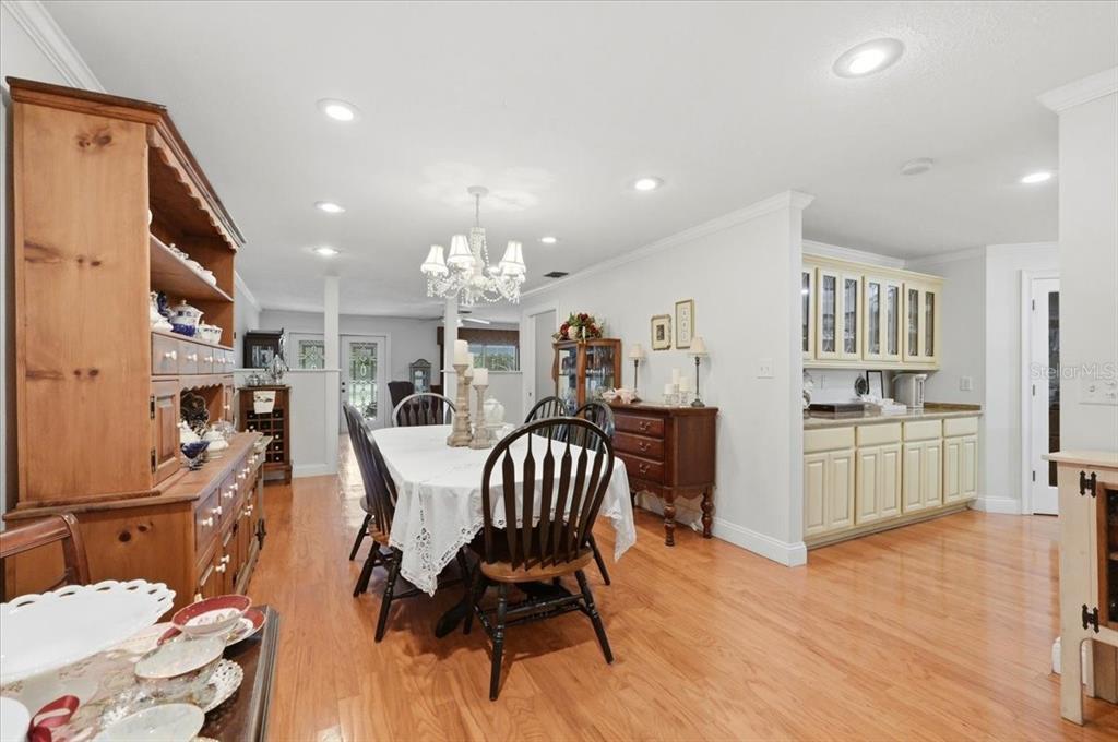 2910 Fritzke Road Dover, FL 33527 - Photo 29 of 100 a view of a dining room with furniture and wooden floor