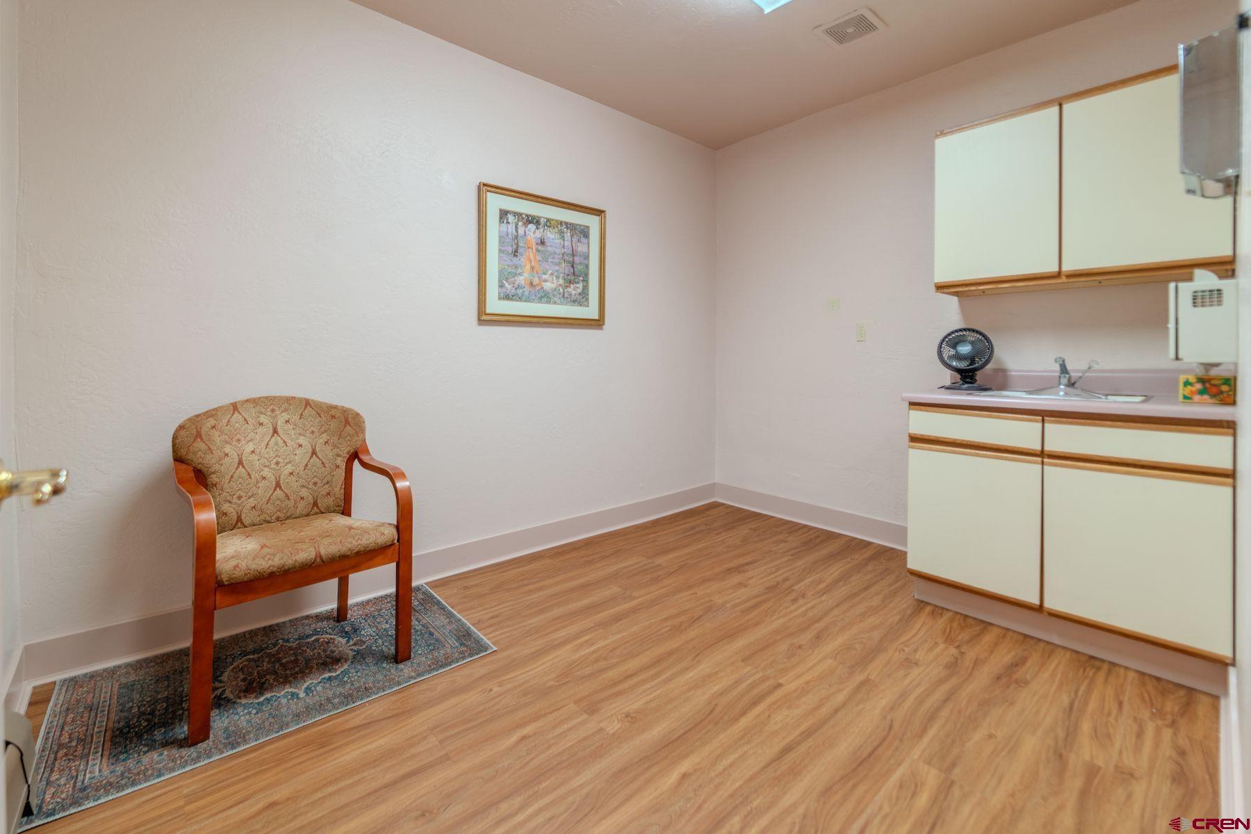 3649 Main Avenue Durango, CO 81301 - Photo 17 of 34 a view of a workspace with wooden floor and a workspace