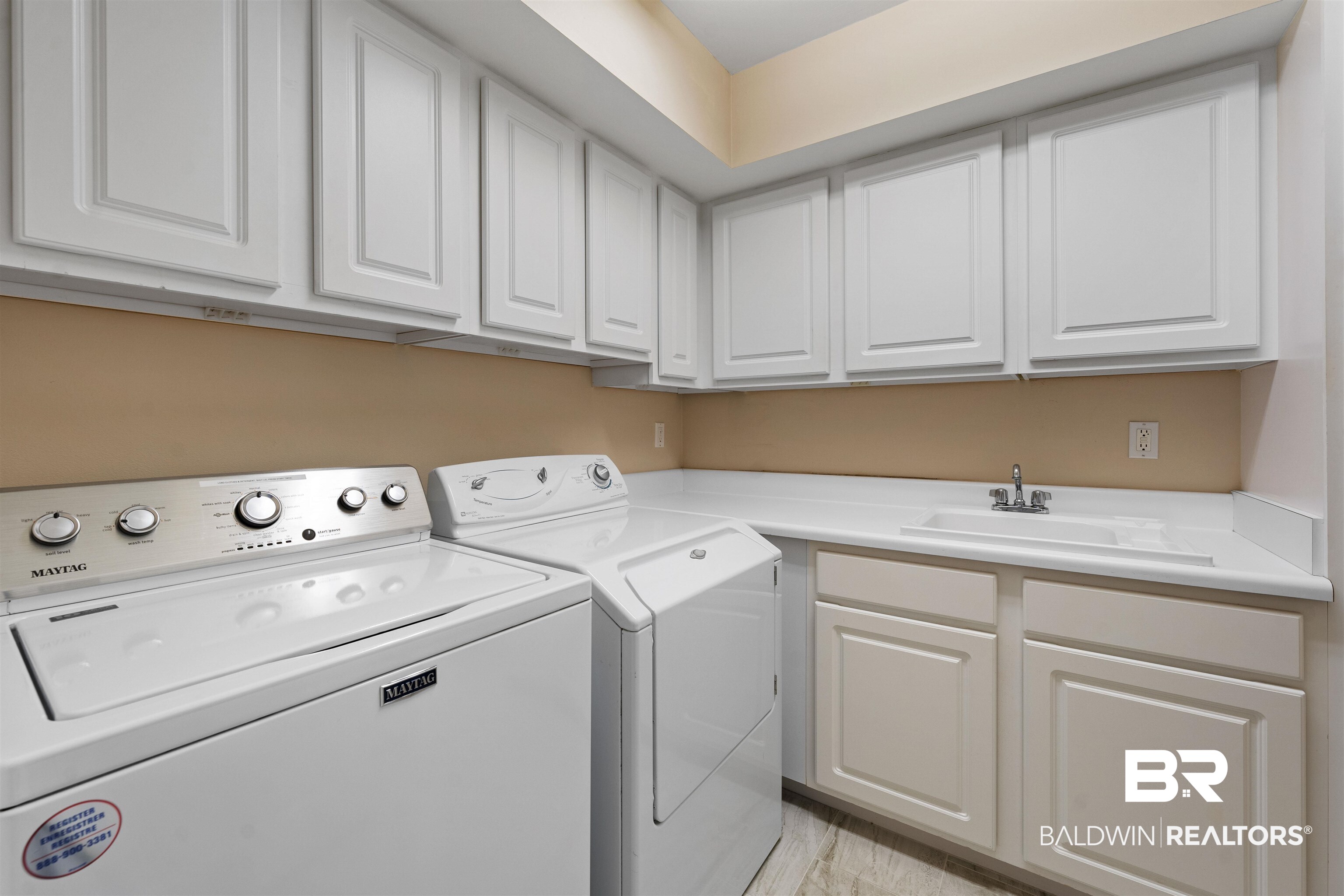 3434 Mariner Circle Orange Beach, AL 36561 - Photo 34 of 38 Washroom with independent washer and dryer, sink, and cabinets