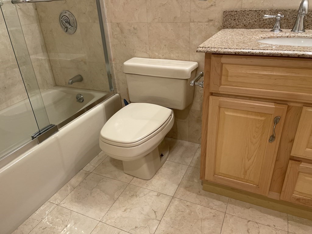20 Webster Street, Unit 405 Brookline, MA 02446 - Photo 10 of 22 a bathroom with a toilet and a shower