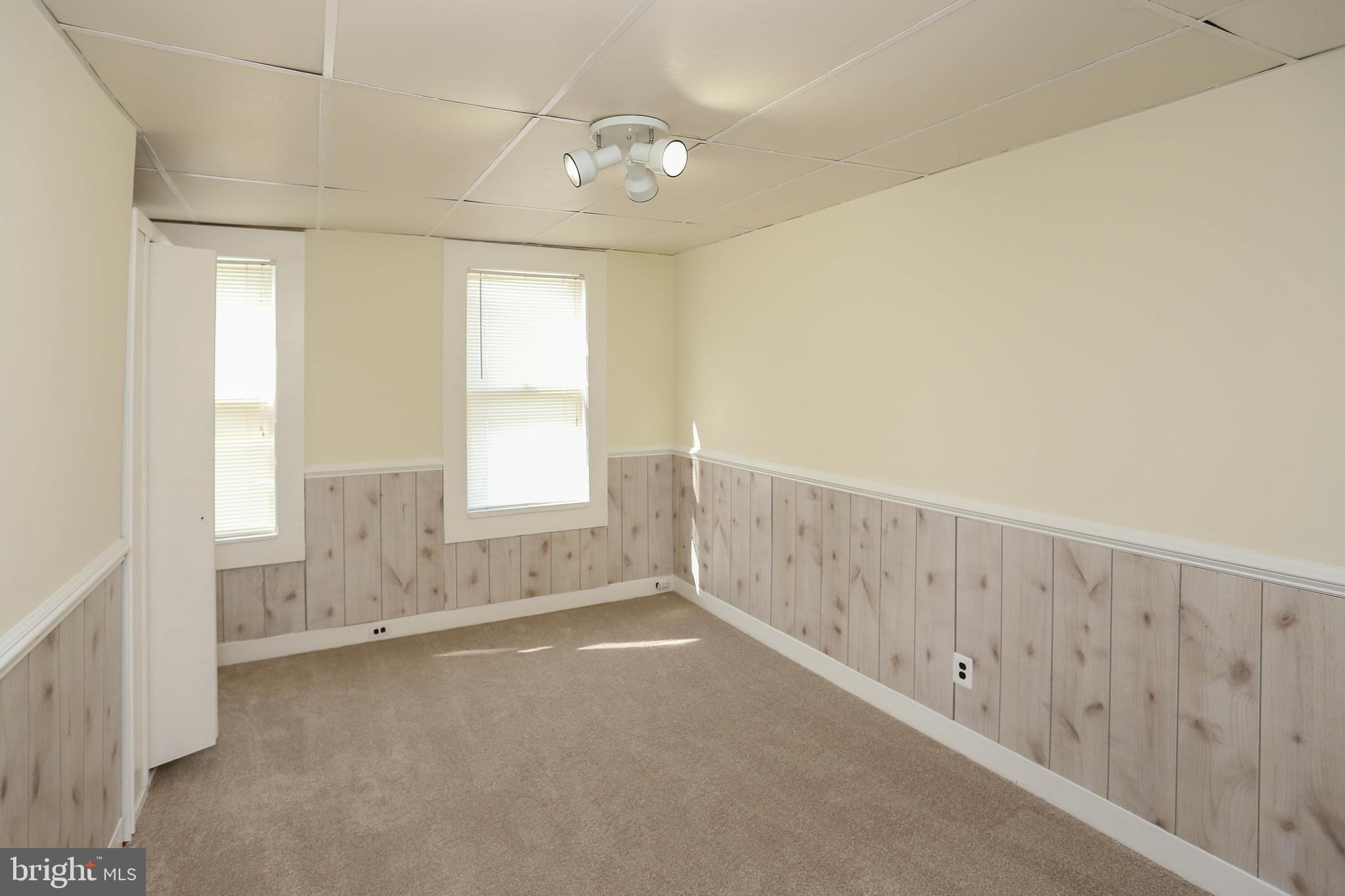 216 Clyde Avenue Halethorpe, MD 21227 - Photo 11 of 49 a view of an empty room with a window