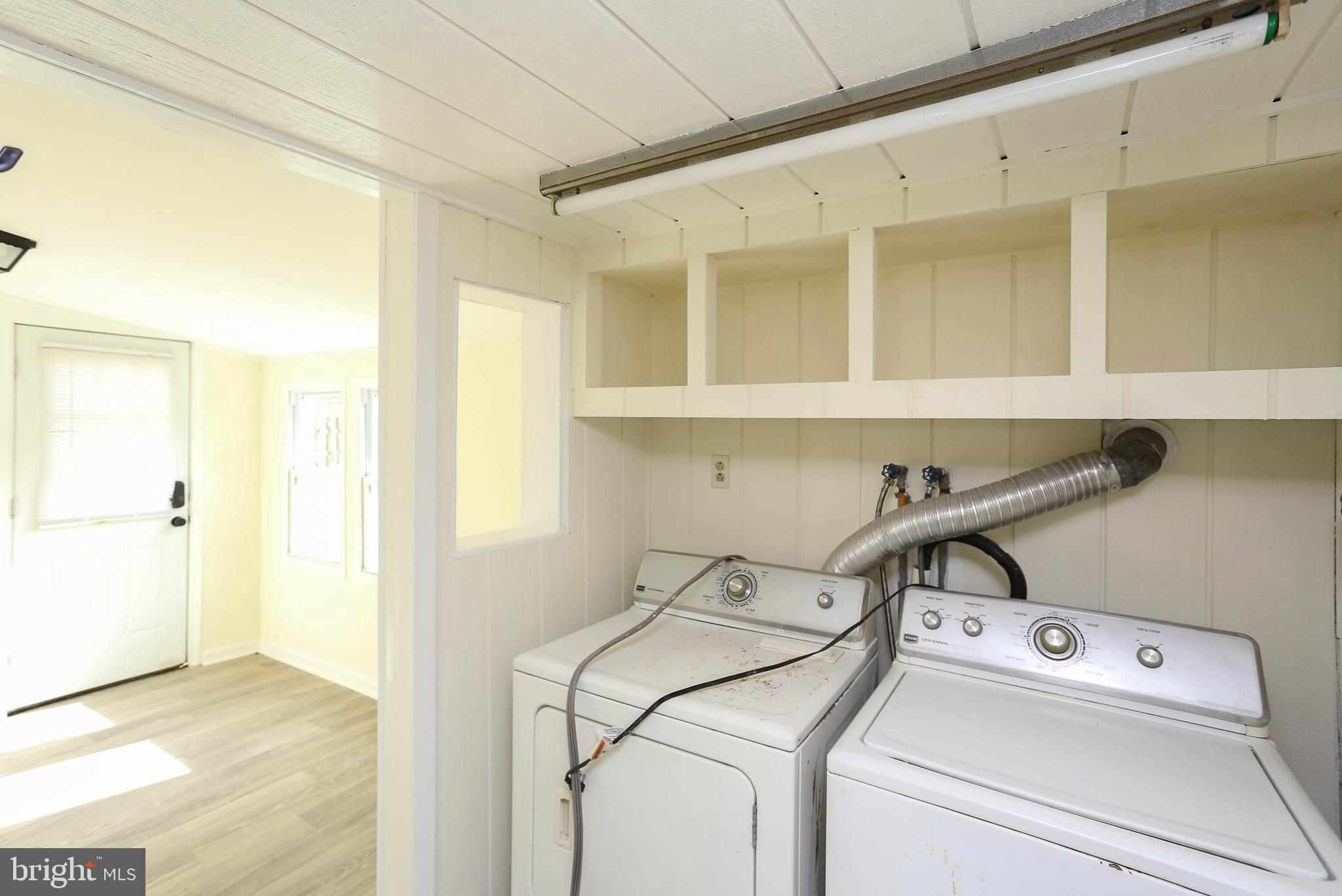 216 Clyde Avenue Halethorpe, MD 21227 - Photo 18 of 49 a view of storage and utility room with washer and dryer
