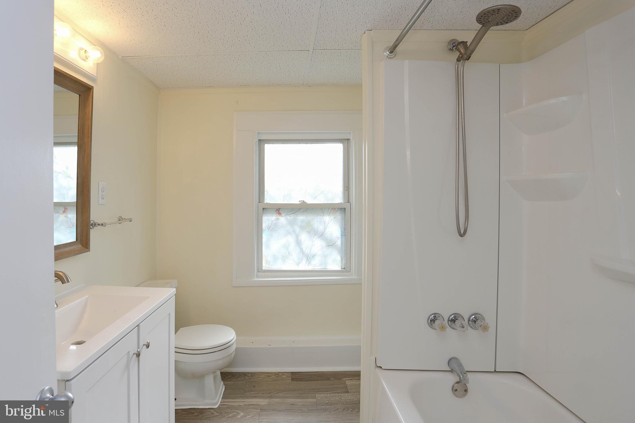 216 Clyde Avenue Halethorpe, MD 21227 - Photo 25 of 49 a bathroom with a toilet sink and shower