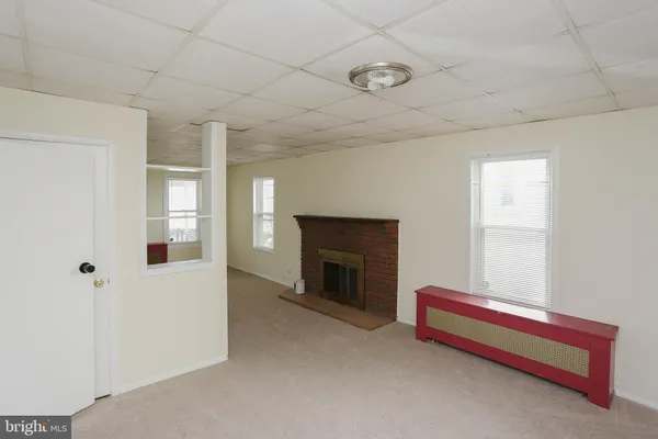 a view of room with racks on the wall