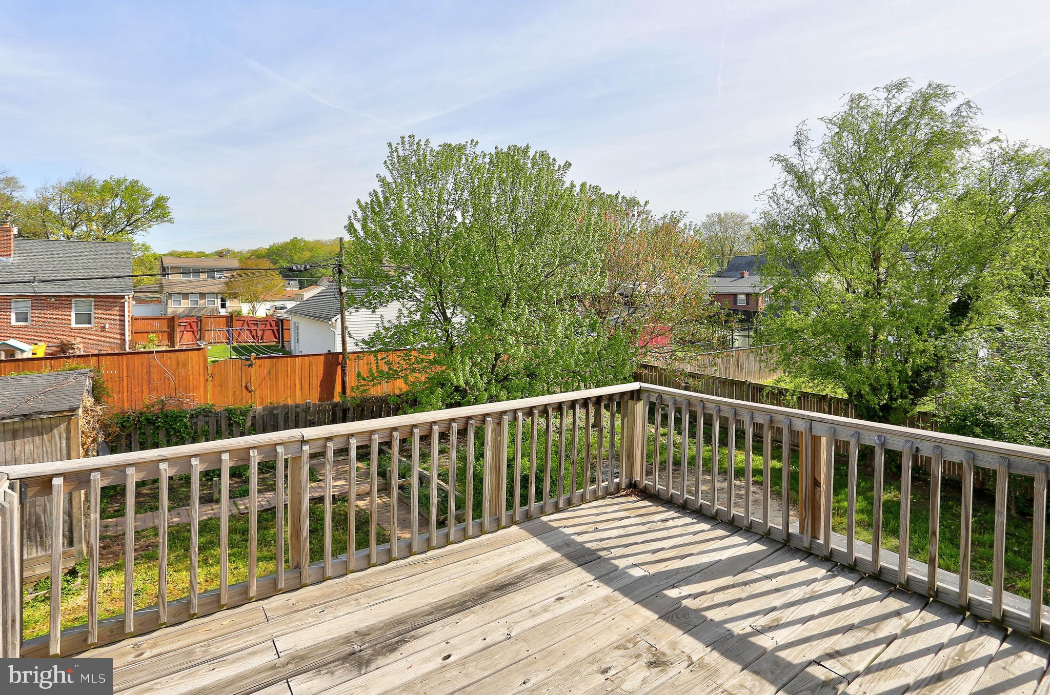 216 Clyde Avenue Halethorpe, MD 21227 - Photo 49 of 49 a view of balcony with wooden floor and fence