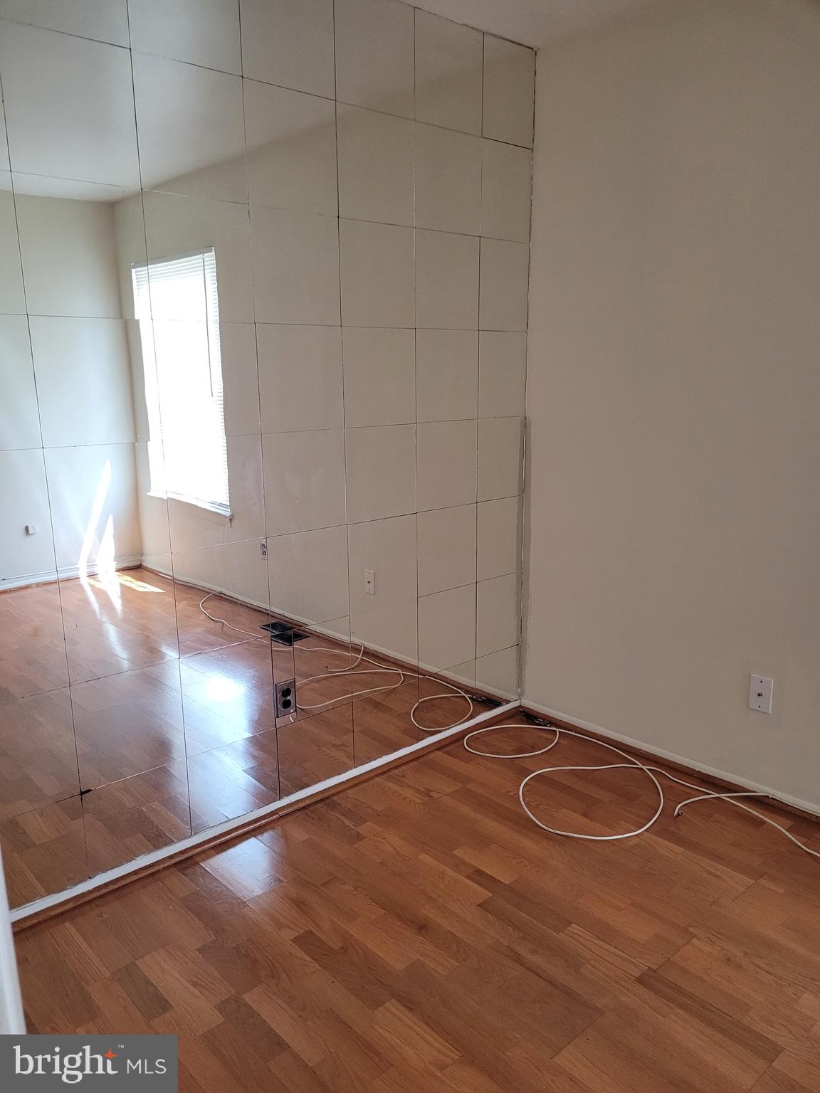3247 Chester Grove Road Upper Marlboro, MD 20774 - Photo 13 of 17 an empty room with wooden floor and windows