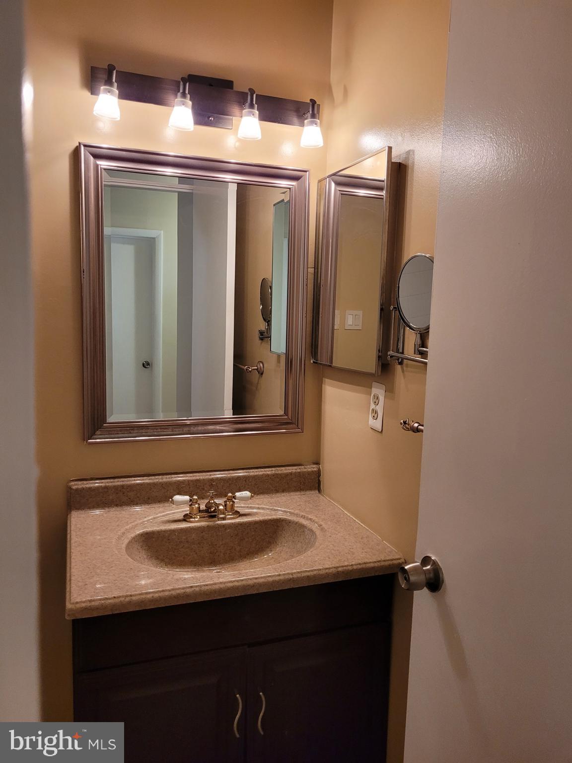 3247 Chester Grove Road Upper Marlboro, MD 20774 - Photo 14 of 17 a bathroom with a sink and a mirror
