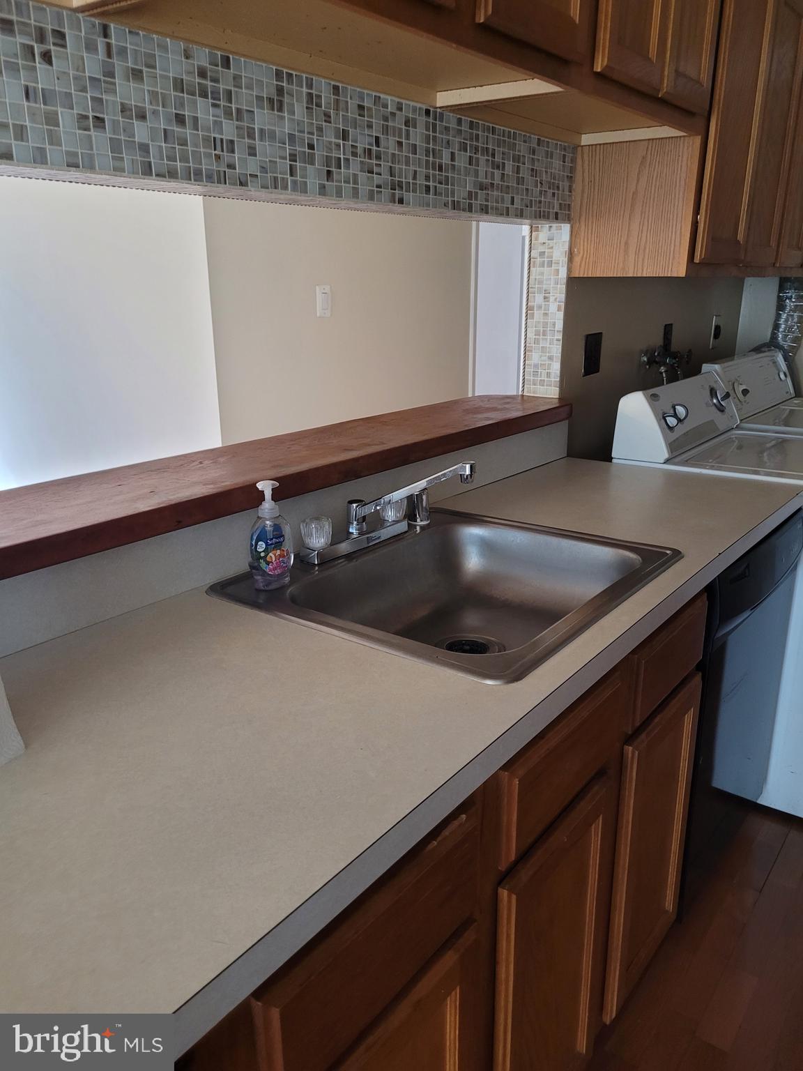 3247 Chester Grove Road Upper Marlboro, MD 20774 - Photo 7 of 17 a close view of sink and microwave