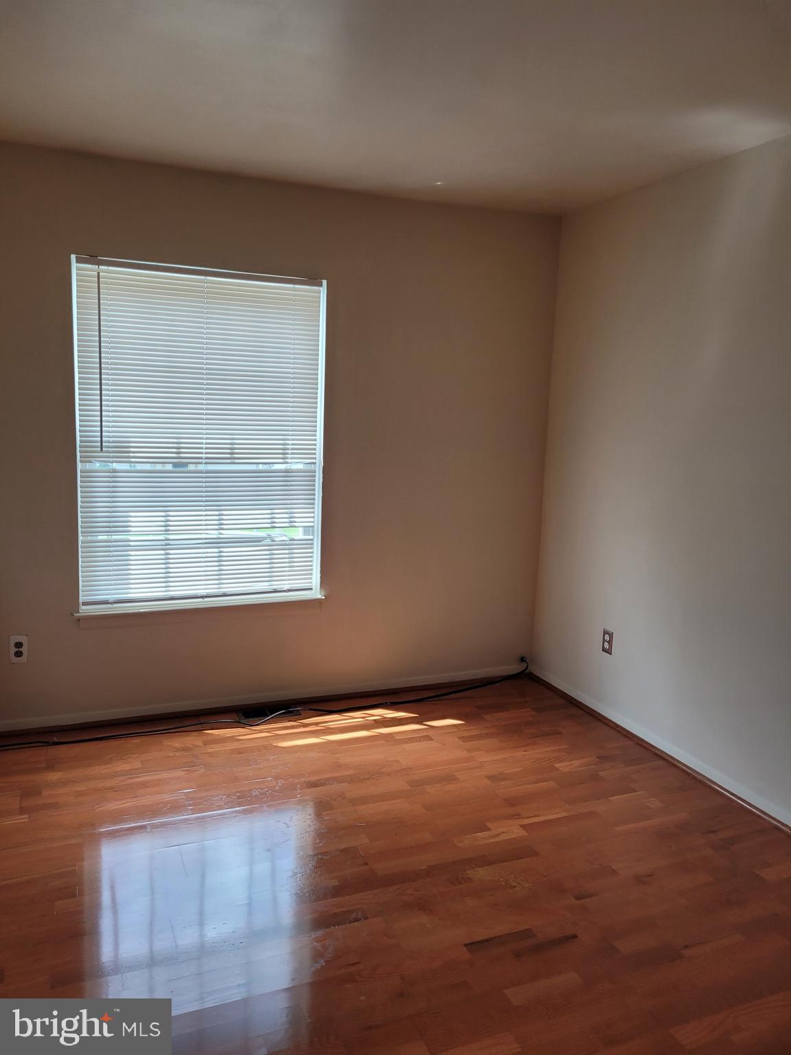 3247 Chester Grove Road Upper Marlboro, MD 20774 - Photo 10 of 17 an empty room with wooden floor and windows