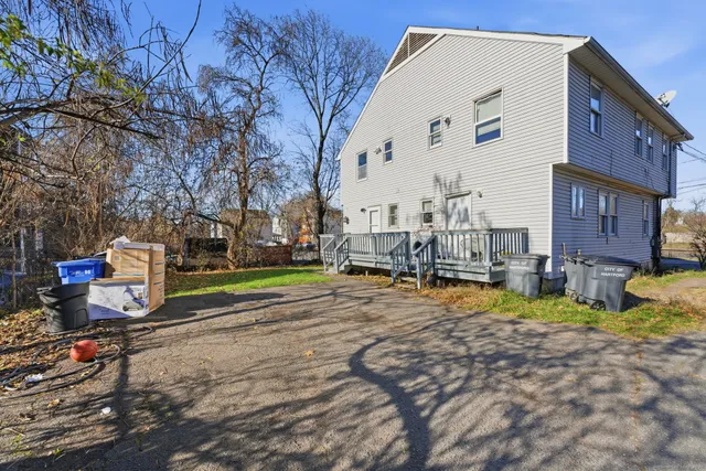 a view of a balcony with wooden floor