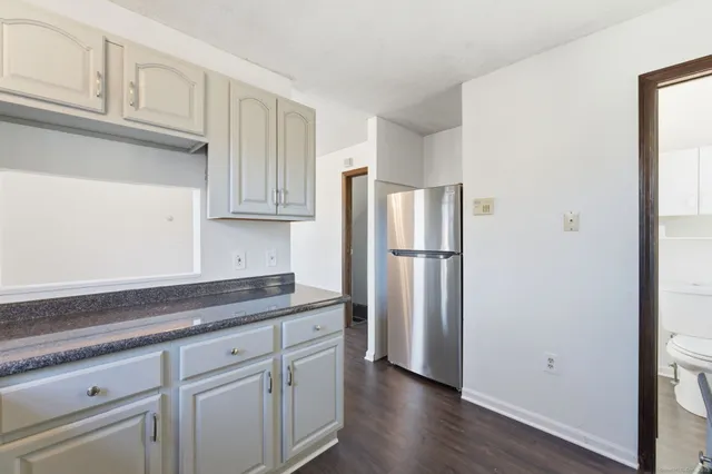 a kitchen with cabinets and stainless steel appliances
