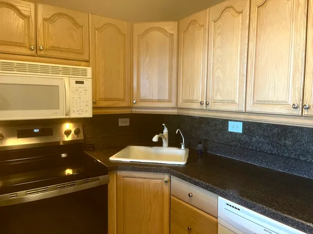 a kitchen with a stove top oven