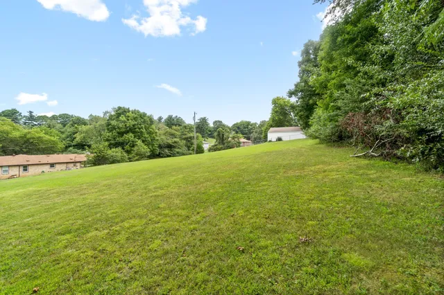 a view of a field with an outdoor space