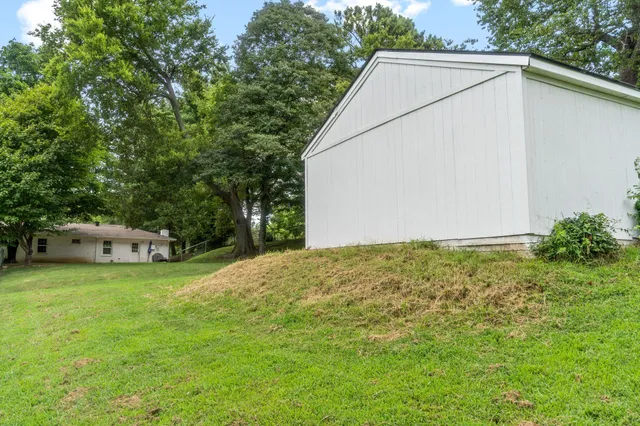 a view of a backyard of the house