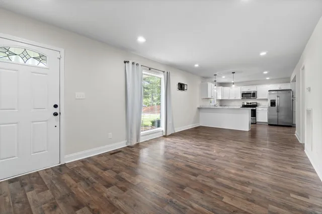 a view of kitchen view wooden floor and window