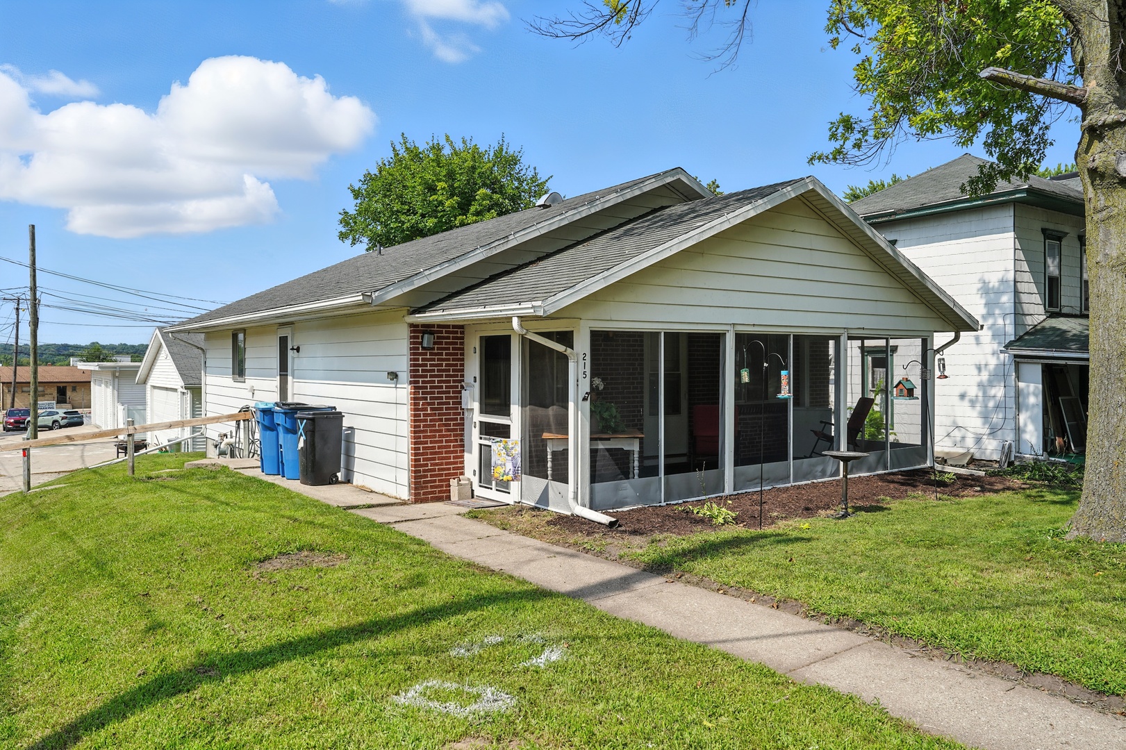 215 East 3rd Street Dixon, IL 61021 - Photo 1 of 16 a view of a house with a yard and sitting area